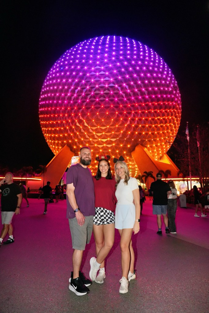 Nick, Lindsey and Anniston in front of the Epcot ball